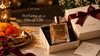 Luxury perfume gift with a burgundy ribbon, ivory gift box, marigold flowers and a glowing Diwali diya.